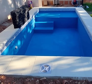 a pool with a water tank and a water tank
