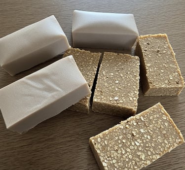 Finished rectangle coffee oat soap bars resting on wooden rustic table