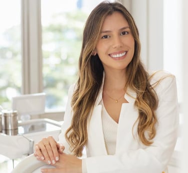 a woman in a white suit and white shirt
