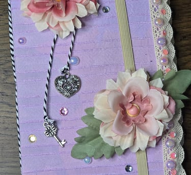 Purple fabric covered journal, handmade fabric flowers, bakers twine, crystal and silver charms