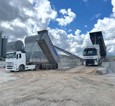 a truck with a dumpster and a dumpster