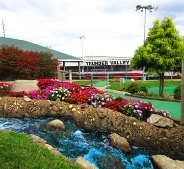 mini golf course with Thunder Valley sign in background 