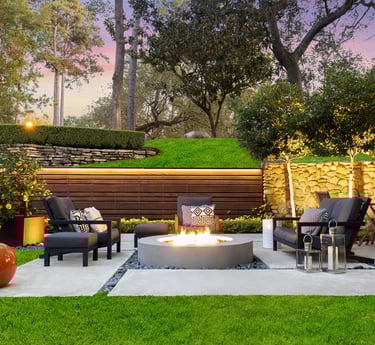 a patio with a fire pit and chairs