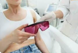 patient take laser shield glass from the therapist