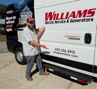 Williams service tech standing next to the service van