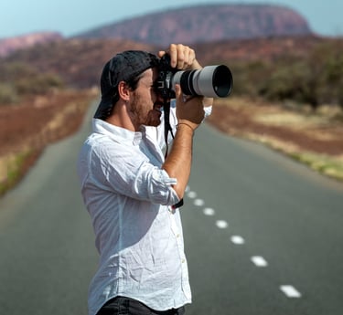 a man taking a picture of himself on the road
