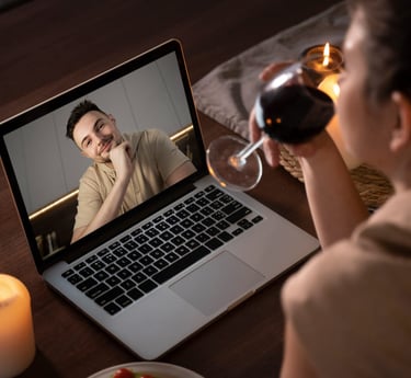 Sugar mommy enjoying a virtual date with a man through an online video call