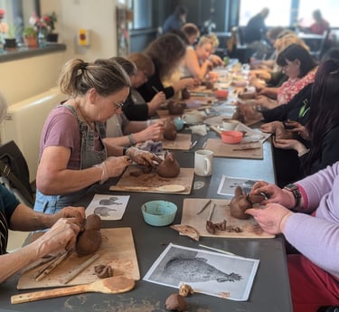 Commuinty Project - Group of people at into Bodmin creating clay pottery hens 