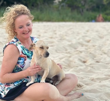 Sunni Dawson smiling with a dog companion during animal communication session