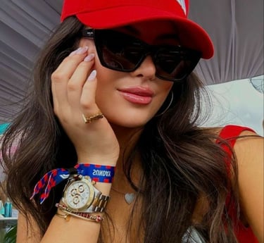 a woman in a red hat and sunglasses