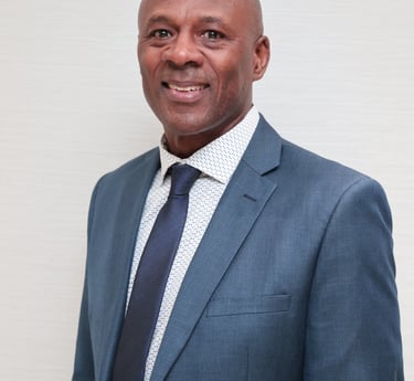 a man in a suit and tie smiling