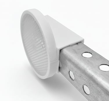 White circular safety reflector mounted on a metal perforated square sign post.