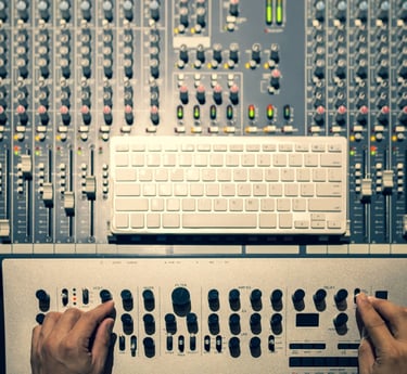 hands on a audio mixer