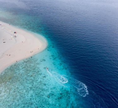 a beach with a sandy beach and a white sand beach