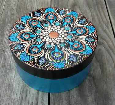 a decorative box with a blue and white flower design