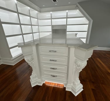 Custom made closet island with handles in a showroom- Britto's Home Improvement