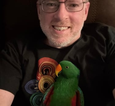 Image of Jeremiah with his parrot named Perrin.