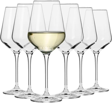 a group of wine glasses with white wine in a row