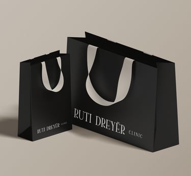 a black and white shopping bag with a white background