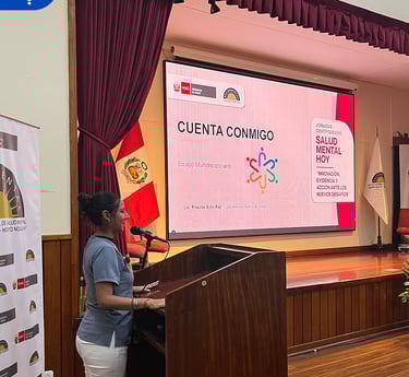 a woman standing at a podium with a presentation