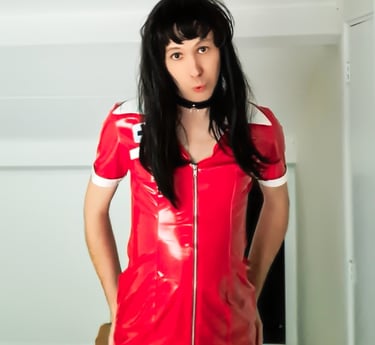 Dutch Sissy Slut Margo wearing a red pvc dress