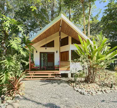 Private jungle cabin with wooden porch at Rose Temple Grove, a feminine retreat sanctuary in Costa R