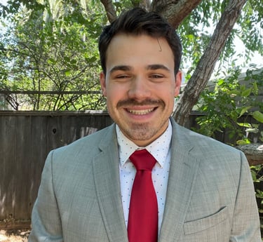 a man in a suit and tie smiling