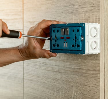 JKO Handyman installing a communications outlet in Lakeland, Winter Haven, and Central Florida.
