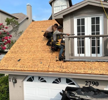 a man is working on a roof with a roof that is being built into a