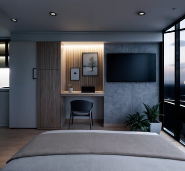 Habitación con escritorio empotrado y ventanales amplios.