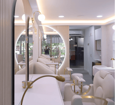 Zona de espera con espejos iluminados y sillones blancos.