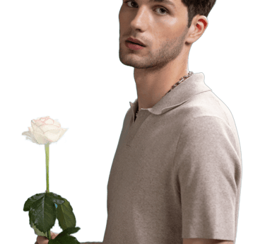 a sugar boy in a polo shirt holding a rose