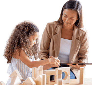 a woman and a child playing with blocks