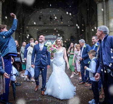 bride and groom having their confetti moment