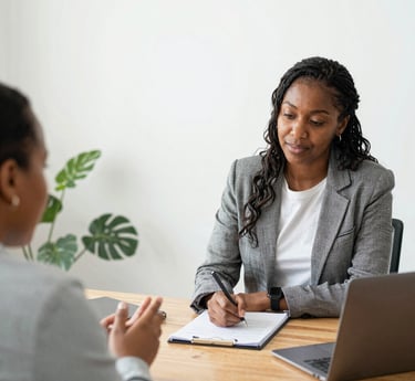A diverse group of professionals collaborating around a table, reflecting inclusivity and teamwork.