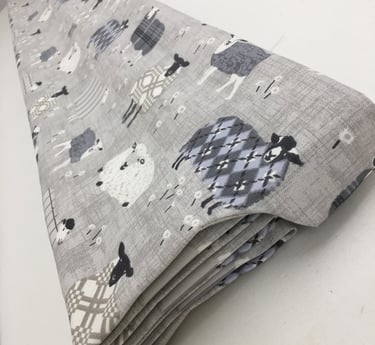 A roman blind with side tab to hide the headrail