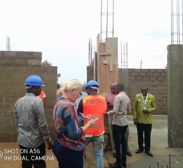 a group of people standing around a building