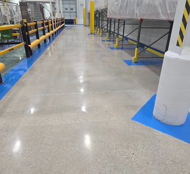 Industrial epoxy flooring and concrete polishing installation in a high production facility