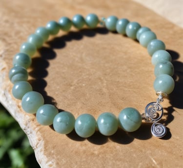 Close-up of a labradorite stone showing its shimmering blue and green flashes.