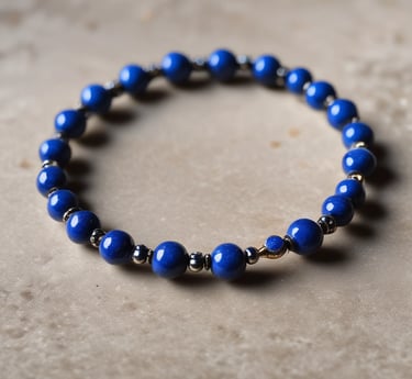 Close-up photo of a polished tiger's eye stone showing its golden-brown bands and silky luster.
