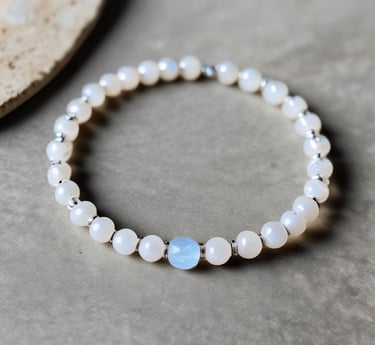 Close-up photo of a polished tiger's eye stone showing its golden-brown bands and silky luster.
