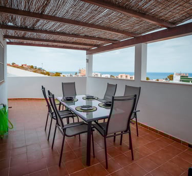 a table with plates and plates on it Cullera