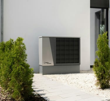 a small air conditioner sitting in front of a house