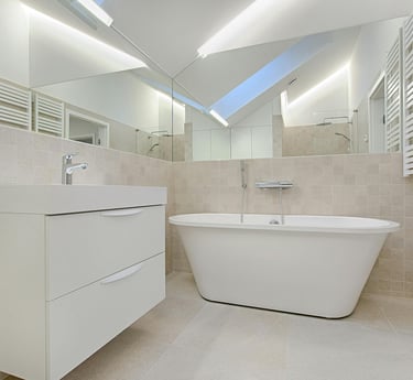 a bathroom with a bathtub and a skylight