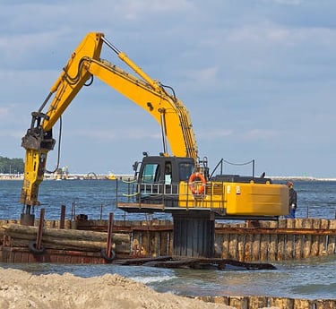 excavator holding logs for dock construction