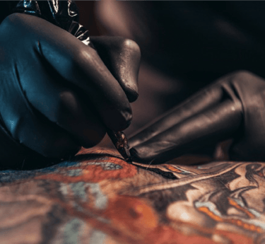 Image of the tattooing process on skin