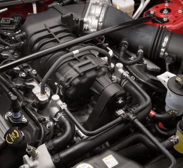 Qualified mobile mechanic performing car diagnostics with state-of-the-art equipment