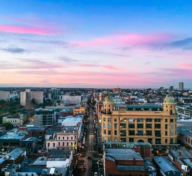 A drone image looking south down Chapel Street Precinct at sunrise