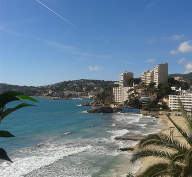 Cala Mayor coastline with a few high rise buildings in background which lies just West of Palma City