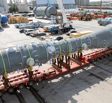 a large pipe - top truck with a large pipe on it